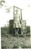 Florence Caldwell standing by a well